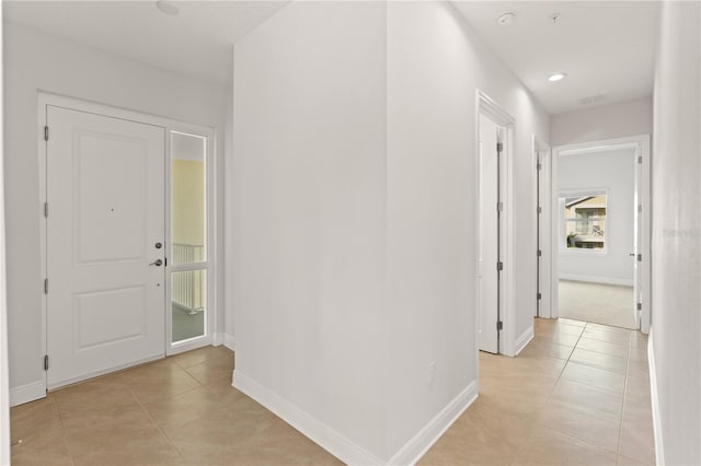 7611 34th Ave W Unit 301, Bradenton, FL 34209 - hallway featuring light tile patterned floors and recessed lighting