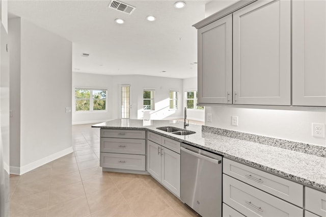 7611 34th Ave W Unit 301, Bradenton, FL 34209 - kitchen with dishwasher, gray cabinets, open floor plan, a peninsula, and light tile patterned floors
