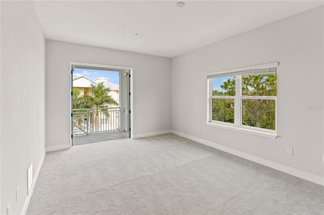 7611 34th Ave W Unit 301, Bradenton, FL 34209 - carpeted spare room featuring plenty of natural light