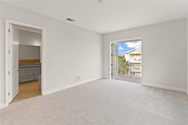 7611 34th Ave W Unit 301, Bradenton, FL 34209 - unfurnished room with light carpet and baseboards