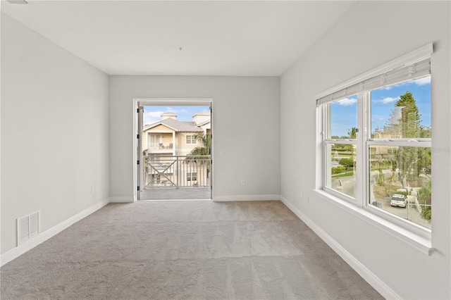 7611 34th Ave W Unit 301, Bradenton, FL 34209 - carpeted empty room with baseboards