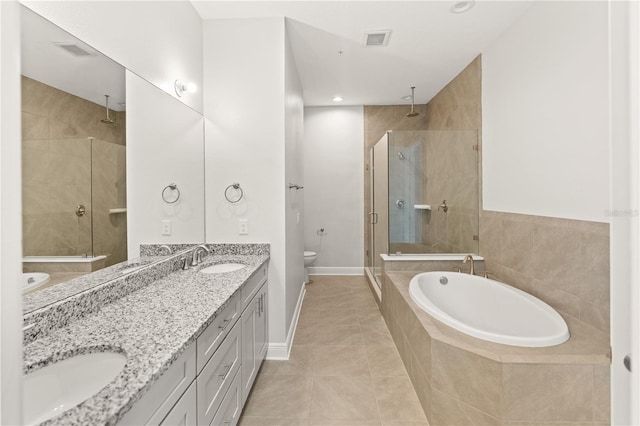 7611 34th Ave W Unit 301, Bradenton, FL 34209 - full bath featuring a shower stall, double vanity, a garden tub, and tile patterned floors