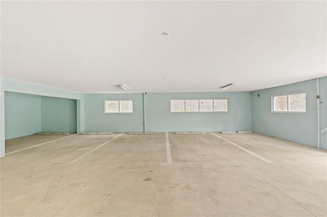 7611 34th Ave W Unit 301, Bradenton, FL 34209 - view of car parking featuring a parking deck