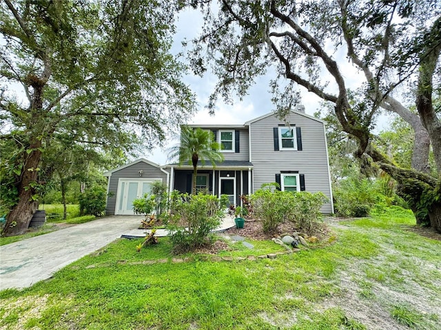 25640 State Road 70 E, Myakka City, FL 34251 - traditional home with concrete driveway and a front lawn