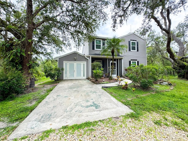 25640 State Road 70 E, Myakka City, FL 34251 - traditional-style home featuring french doors and a front lawn