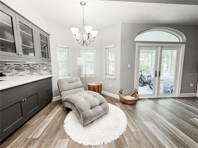 25640 State Road 70 E, Myakka City, FL 34251 - living area featuring light wood-type flooring and a chandelier