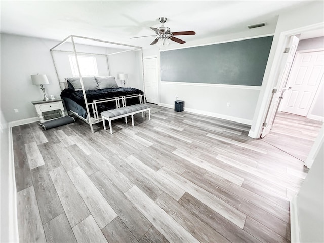 25640 State Road 70 E, Myakka City, FL 34251 - bedroom with wood finished floors and ceiling fan
