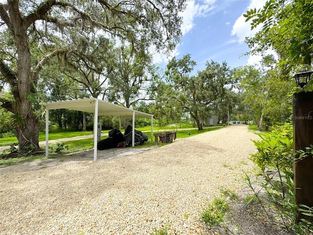 25640 State Road 70 E, Myakka City, FL 34251 - view of yard featuring a carport and gravel driveway