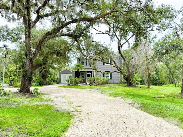 25640 State Road 70 E, Myakka City, FL 34251 - view of front facade with dirt driveway and a front yard
