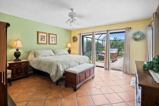 8703 53rd Ave W, Bradenton, FL 34210 - bedroom featuring access to exterior, a textured ceiling, ceiling fan, and light tile patterned floors