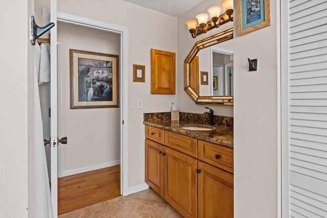 8703 53rd Ave W, Bradenton, FL 34210 - bathroom featuring vanity and wood finished floors