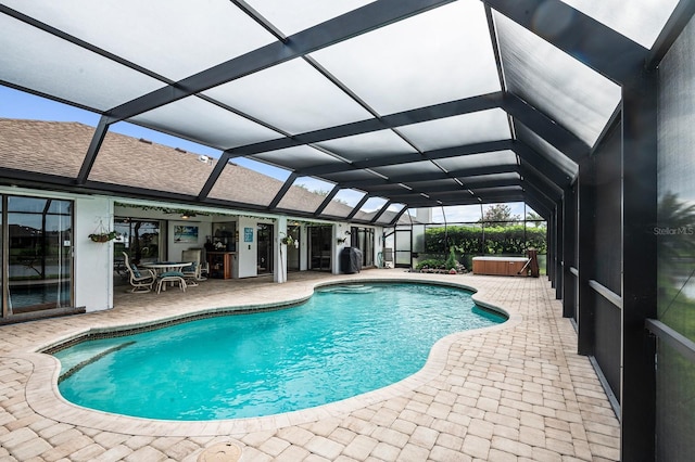 8703 53rd Ave W, Bradenton, FL 34210 - outdoor pool with a hot tub, a patio, and a lanai