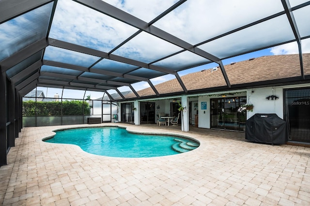 8703 53rd Ave W, Bradenton, FL 34210 - view of swimming pool featuring area for grilling, a patio area, and a lanai