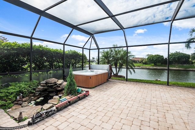 8703 53rd Ave W, Bradenton, FL 34210 - view of patio / terrace with a hot tub, a water view, and a lanai