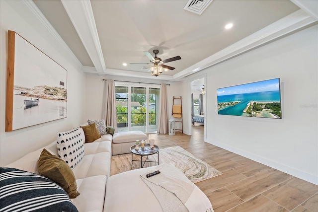 1876 Livingstone St, Sarasota, FL 34231 - living area with a raised ceiling, recessed lighting, a ceiling fan, light wood-style floors, and crown molding