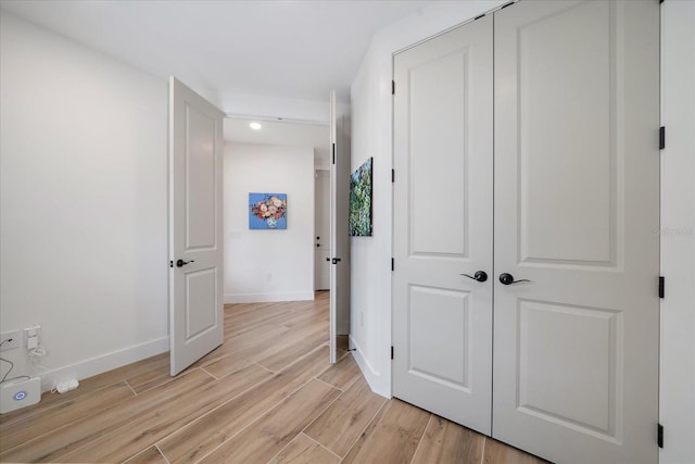1876 Livingstone St, Sarasota, FL 34231 - hallway with light wood-style floors and recessed lighting