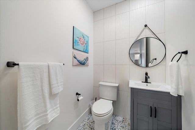 1876 Livingstone St, Sarasota, FL 34231 - half bathroom with vanity, tile walls, and tile patterned floors