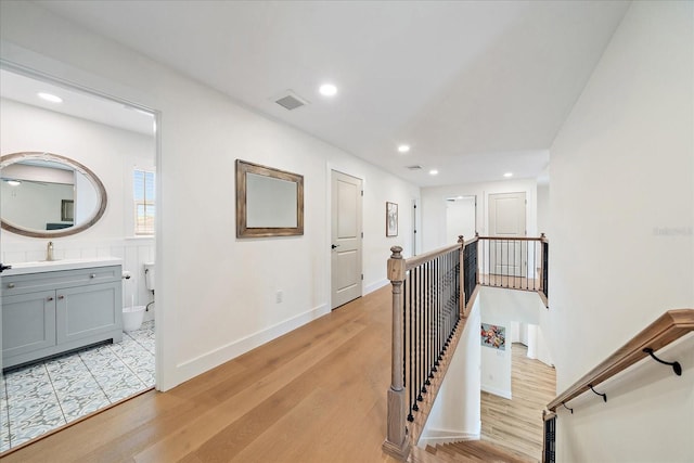 1876 Livingstone St, Sarasota, FL 34231 - hall featuring an upstairs landing, light wood-style flooring, and recessed lighting