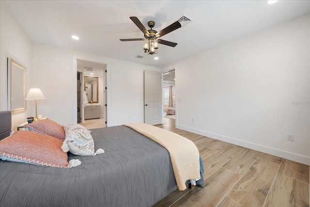 1876 Livingstone St, Sarasota, FL 34231 - bedroom with light wood-type flooring, recessed lighting, connected bathroom, and a ceiling fan