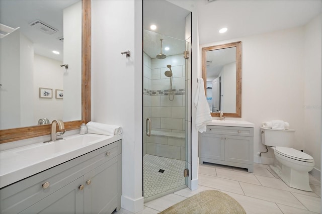 1876 Livingstone St, Sarasota, FL 34231 - bathroom with a shower stall, two vanities, tile patterned floors, and recessed lighting