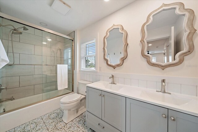 1876 Livingstone St, Sarasota, FL 34231 - bathroom featuring shower / bath combination with glass door, double vanity, and tile patterned flooring