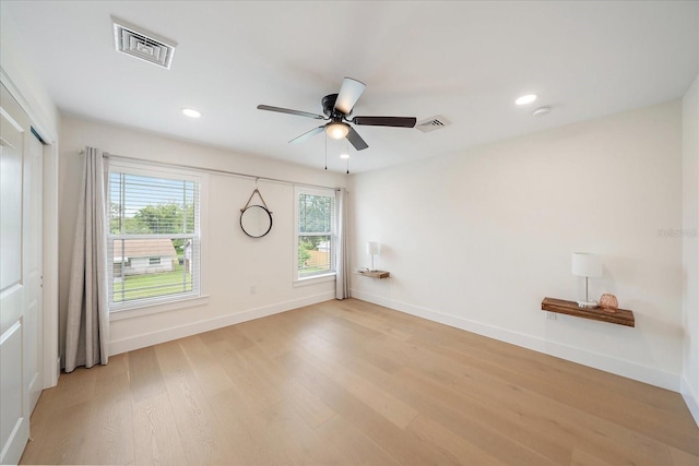 1876 Livingstone St, Sarasota, FL 34231 - spare room featuring light wood-style flooring, ceiling fan, recessed lighting, and a smoke detector