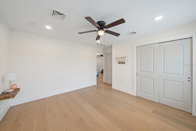 1876 Livingstone St, Sarasota, FL 34231 - unfurnished bedroom with light wood-style flooring, recessed lighting, a closet, and ceiling fan