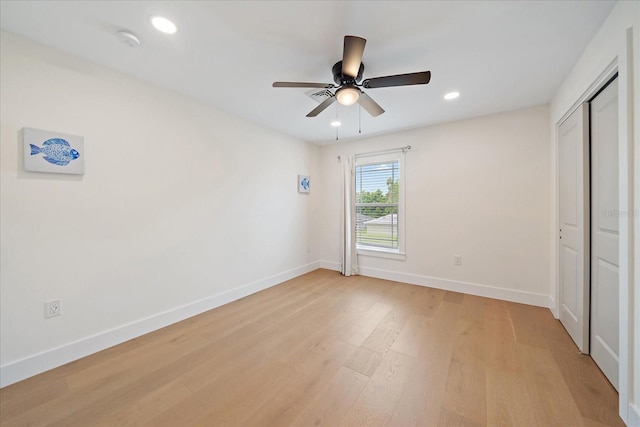 1876 Livingstone St, Sarasota, FL 34231 - unfurnished bedroom with light wood-style floors, recessed lighting, a closet, and ceiling fan