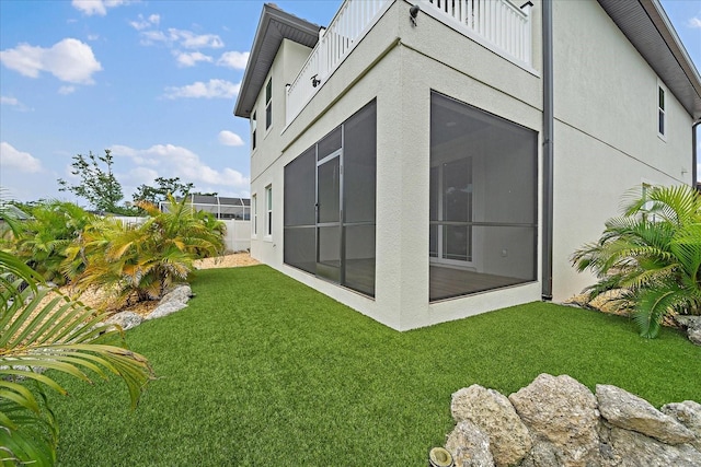 1876 Livingstone St, Sarasota, FL 34231 - rear view of property featuring board and batten siding, a sunroom, and stucco siding