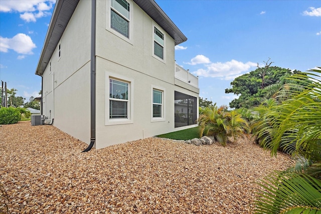 1876 Livingstone St, Sarasota, FL 34231 - rear view of house with stucco siding and a sunroom