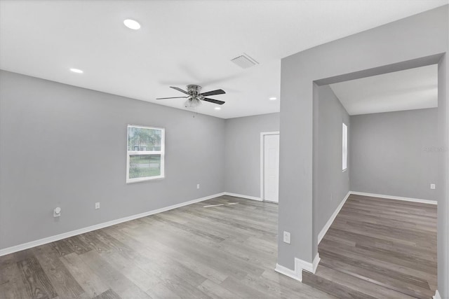 3327 King Blvd, Sarasota, FL 34234 - spare room featuring ceiling fan, wood finished floors, and recessed lighting