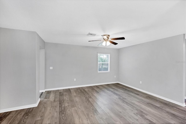 3327 King Blvd, Sarasota, FL 34234 - unfurnished room featuring a ceiling fan and dark wood-style floors