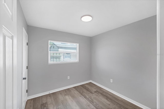 3327 King Blvd, Sarasota, FL 34234 - spare room featuring wood finished floors and baseboards