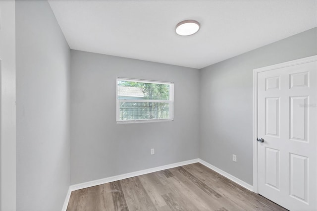 3327 King Blvd, Sarasota, FL 34234 - unfurnished room featuring wood finished floors and baseboards
