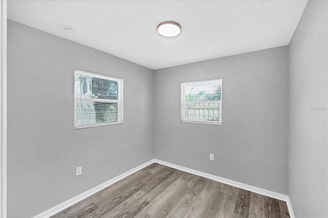 3327 King Blvd, Sarasota, FL 34234 - empty room featuring wood finished floors