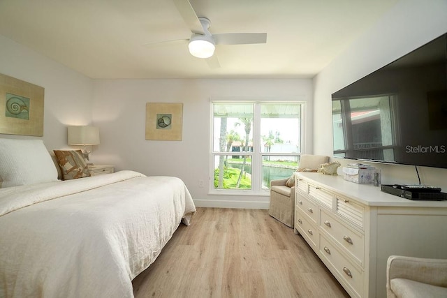 1801 Gulf Dr N Unit 276, Bradenton Beach, FL 34217 - bedroom with light wood-style floors and ceiling fan