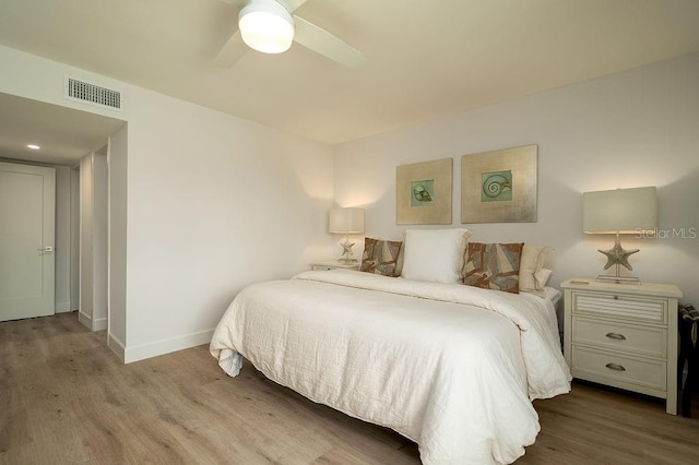 1801 Gulf Dr N Unit 276, Bradenton Beach, FL 34217 - bedroom with wood finished floors and ceiling fan