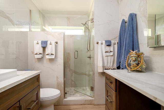 1801 Gulf Dr N Unit 276, Bradenton Beach, FL 34217 - bathroom with vanity, a marble finish shower, crown molding, and tile walls