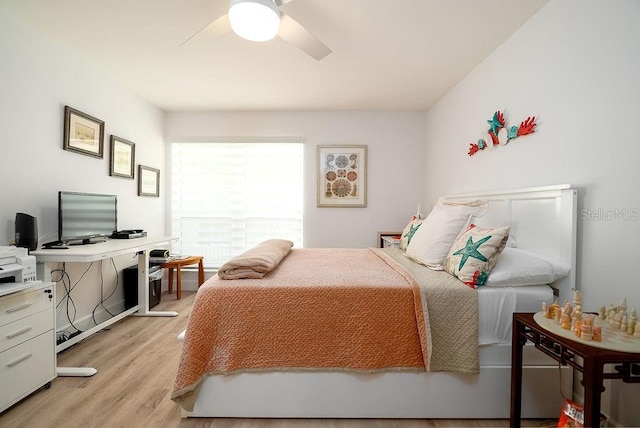 1801 Gulf Dr N Unit 276, Bradenton Beach, FL 34217 - bedroom with light wood-type flooring, a ceiling fan, and a desk