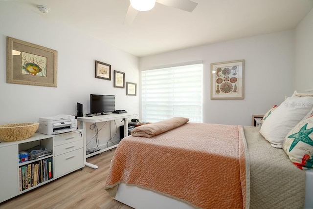 1801 Gulf Dr N Unit 276, Bradenton Beach, FL 34217 - bedroom with light wood finished floors, ceiling fan, and an office area