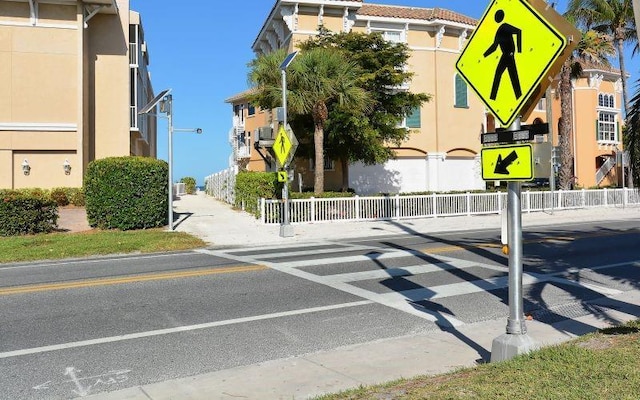 1801 Gulf Dr N Unit 276, Bradenton Beach, FL 34217 - view of asphalt road with traffic signs and sidewalks
