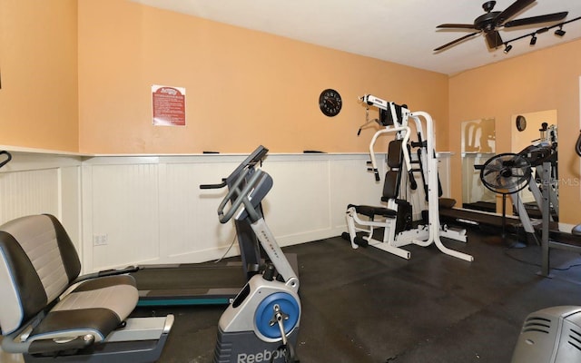 1801 Gulf Dr N Unit 276, Bradenton Beach, FL 34217 - workout room with ceiling fan, wainscoting, and a decorative wall