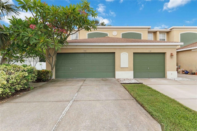2303 28th Ave E, Palmetto, FL 34221 - view of property featuring stucco siding and driveway