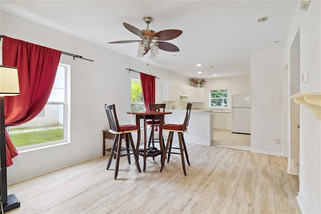 2303 28th Ave E, Palmetto, FL 34221 - dining room featuring light wood-type flooring, ceiling fan, and recessed lighting