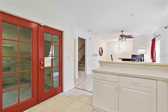 2303 28th Ave E, Palmetto, FL 34221 - kitchen featuring white cabinetry, a ceiling fan, light tile patterned flooring, light countertops, and a peninsula