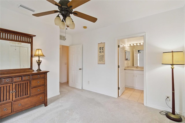 2303 28th Ave E, Palmetto, FL 34221 - bedroom with light colored carpet and ensuite bath