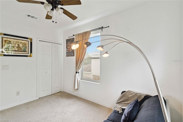 2303 28th Ave E, Palmetto, FL 34221 - living area with ceiling fan and carpet flooring
