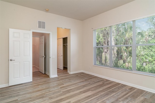 5405 98th Ave E, Parrish, FL 34219 - unfurnished bedroom with light wood-style floors and a closet
