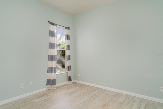 5405 98th Ave E, Parrish, FL 34219 - spare room featuring wood finished floors and baseboards