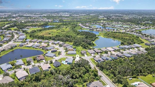 5405 98th Ave E, Parrish, FL 34219 - aerial view of property and surrounding area with nearby suburban area and a large body of water